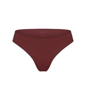 SKIMS Naked Dipped Thong in Oxblood